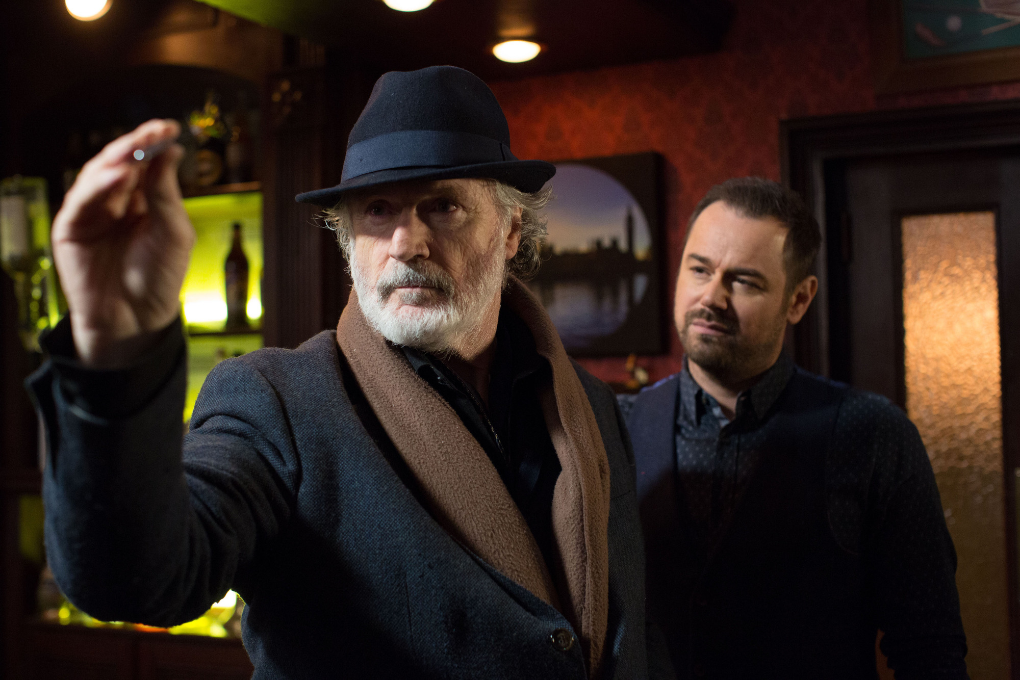 Aidan playing darts on EastEnders
