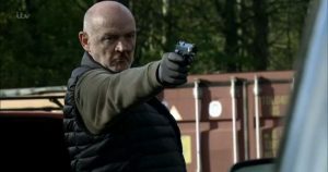 Pat Phelan with a gun