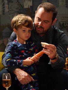 Mick helps Ollie leave a mince pie and carrot for Santa (Credit: BBC)