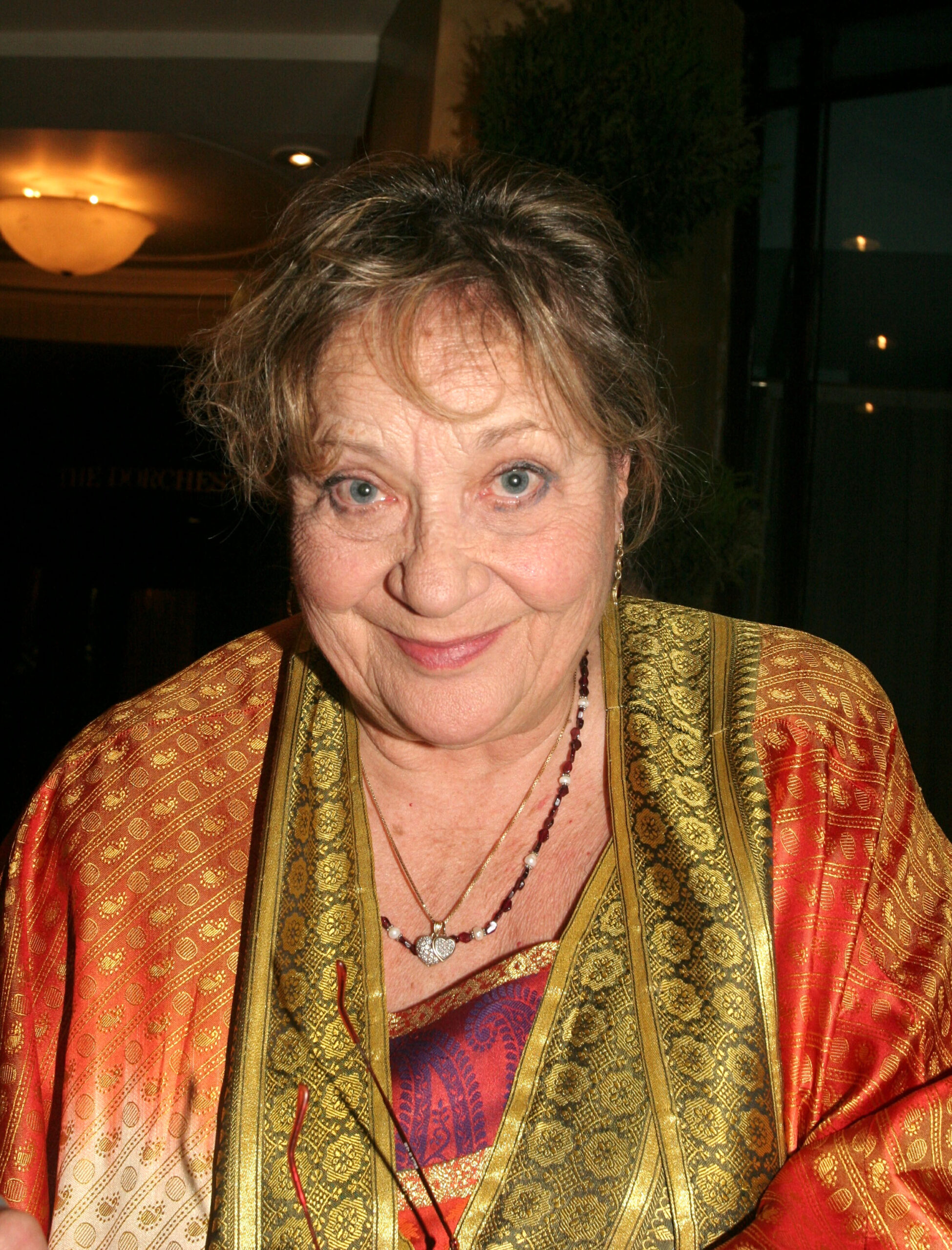 Sylvia Syms smiling at camera
