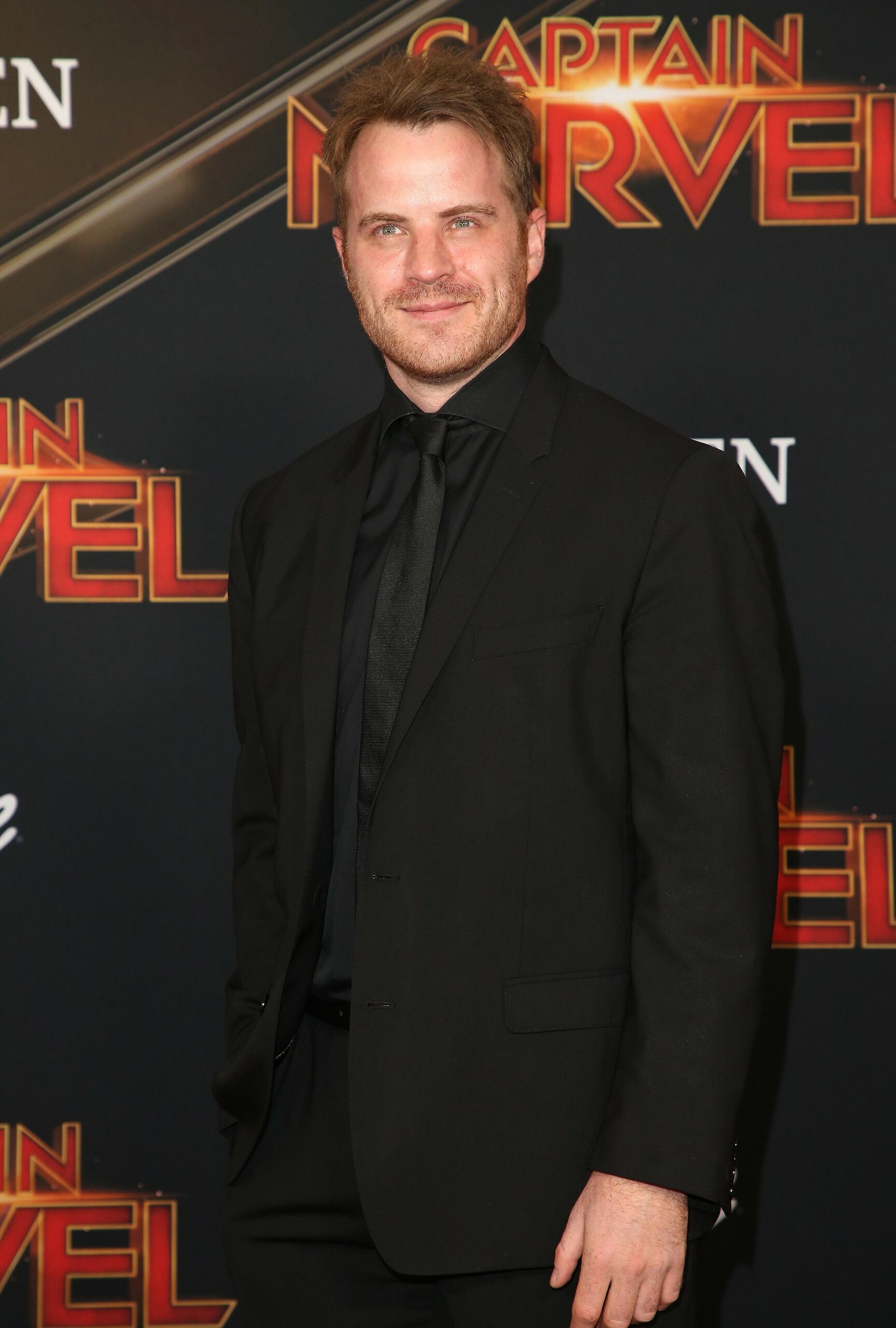 EastEnders star Rob Kazinsky smiling at event