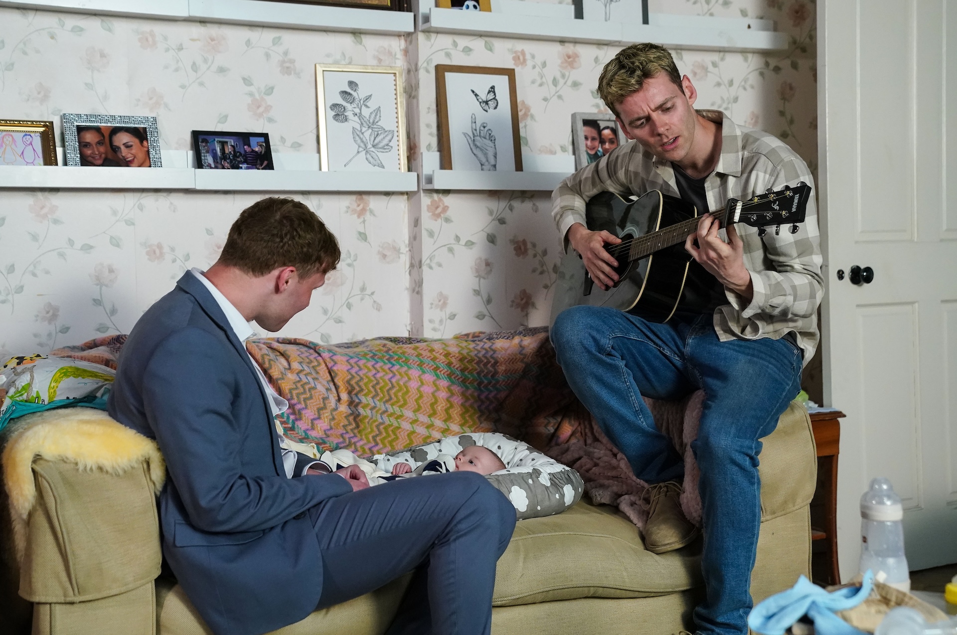 Peter Beale on the guitar on EastEnders as he sits with Jay