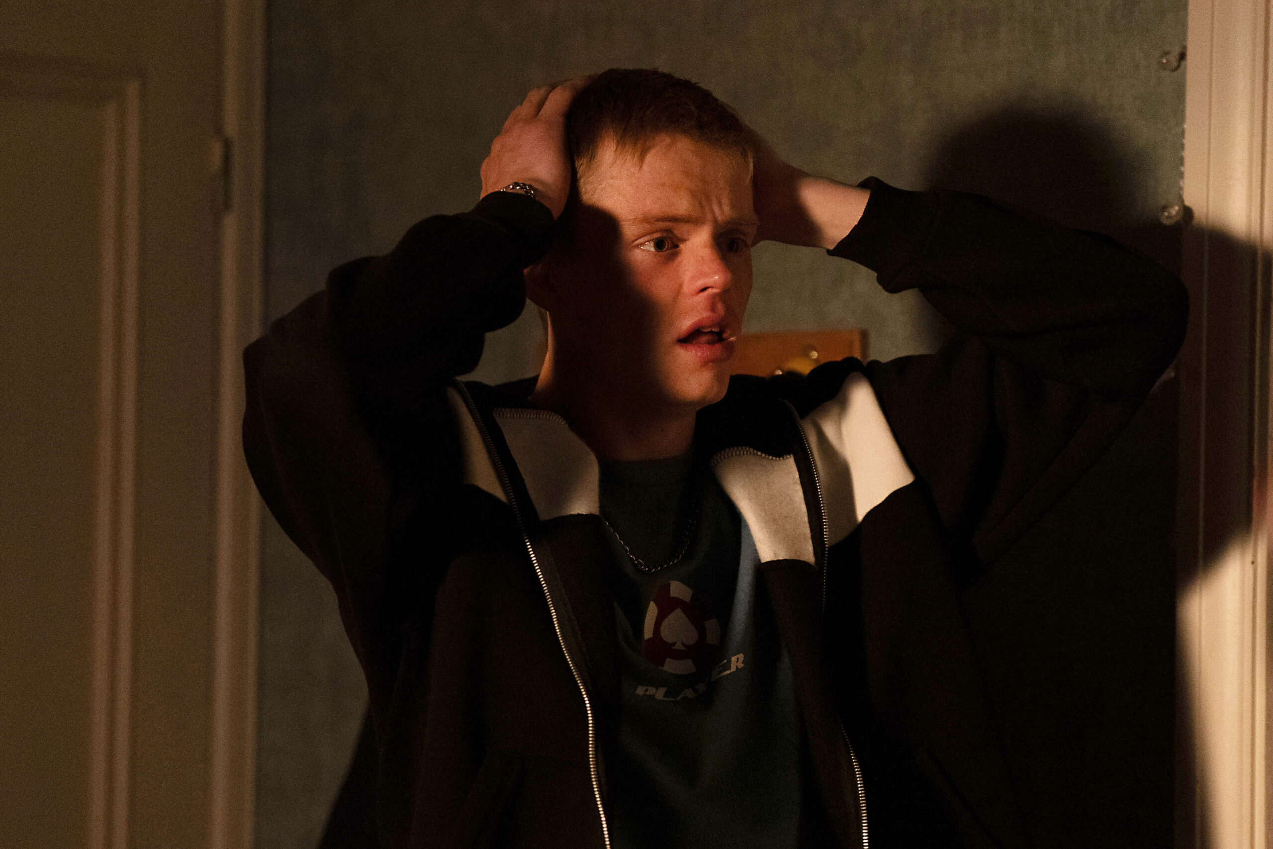 Oscar clutches his head in horror in EastEnders