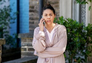 Priya makes a phone call in EastEnders