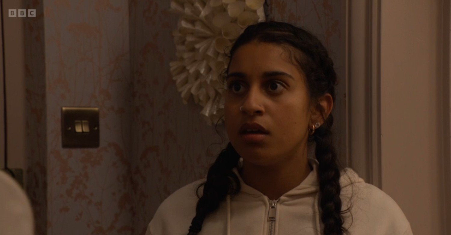 Avani looks shocked on EastEnders