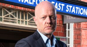 Max looks glum in an EastEnders publicity shot (Credit: BBC/Composite: EI)