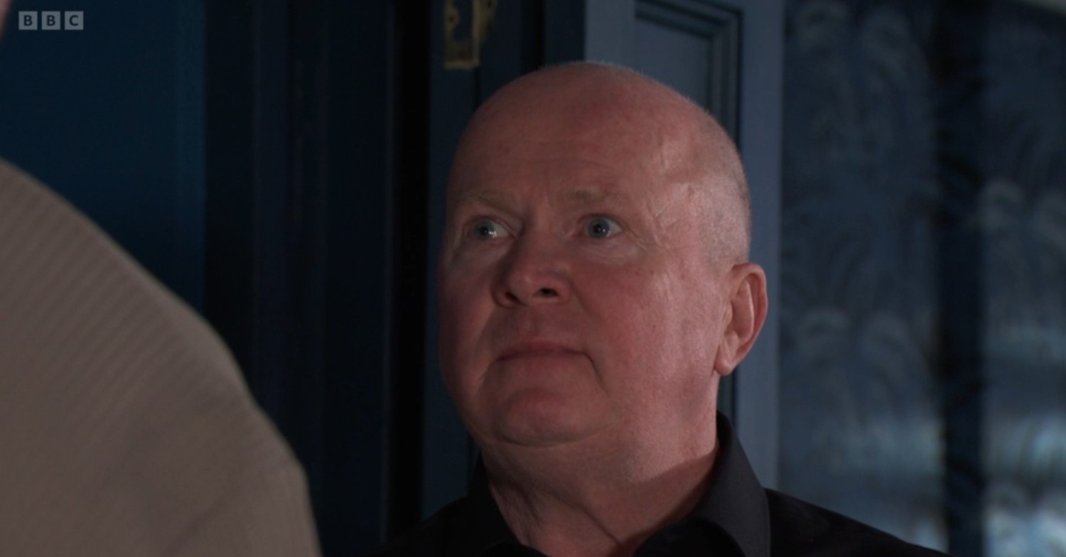 Phil looks angry on EastEnders