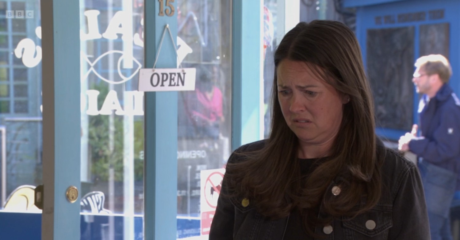 Stacey looks disgusted in the chip shop on EastEnders