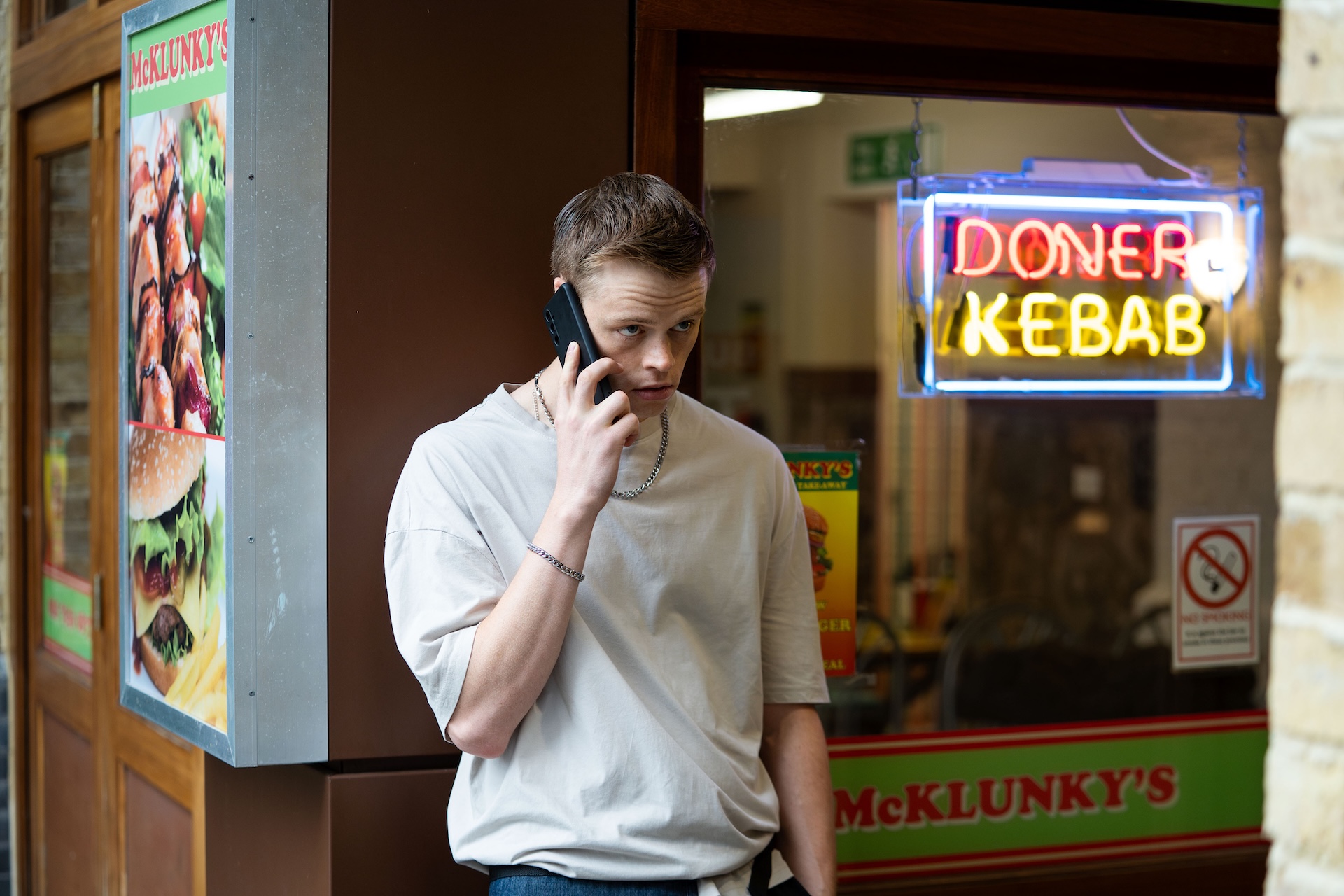 Oscar on rthe phone in EastEnders