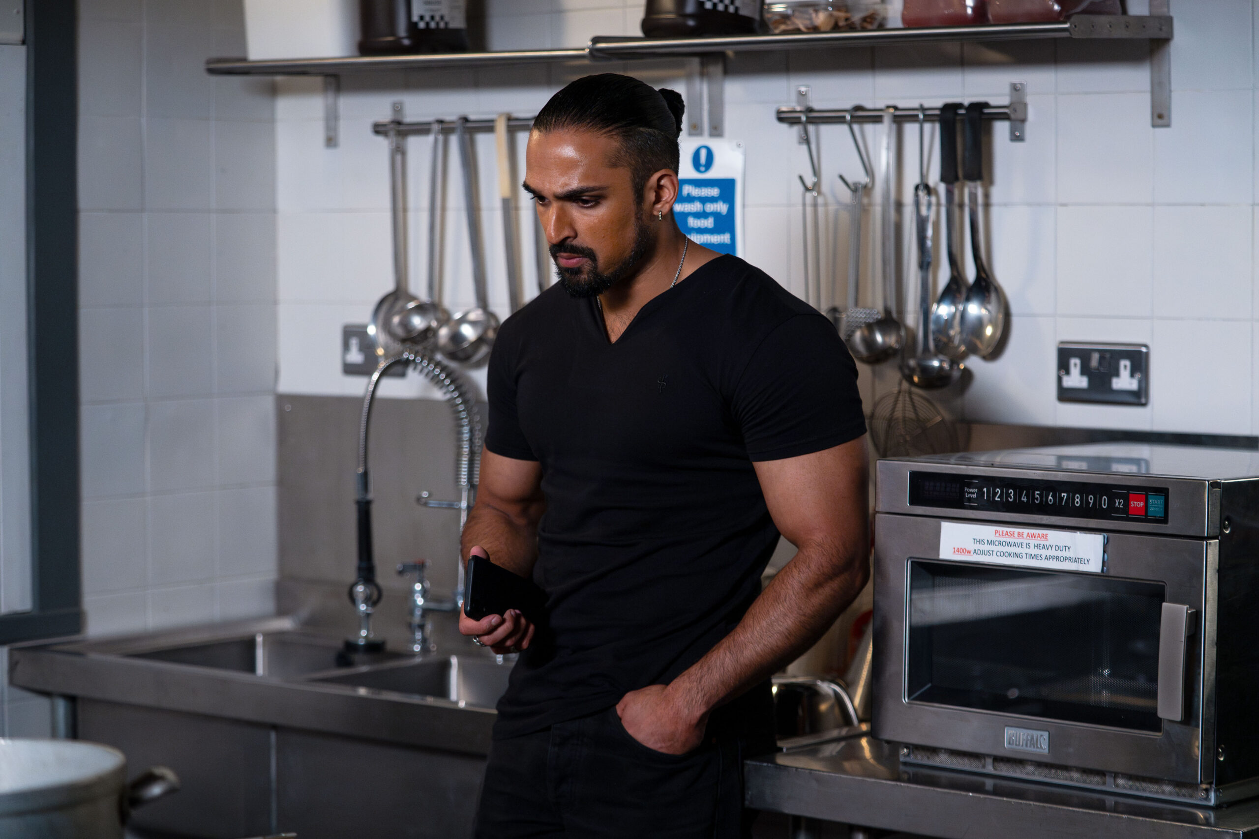 Ravi looks worried in EastEnders