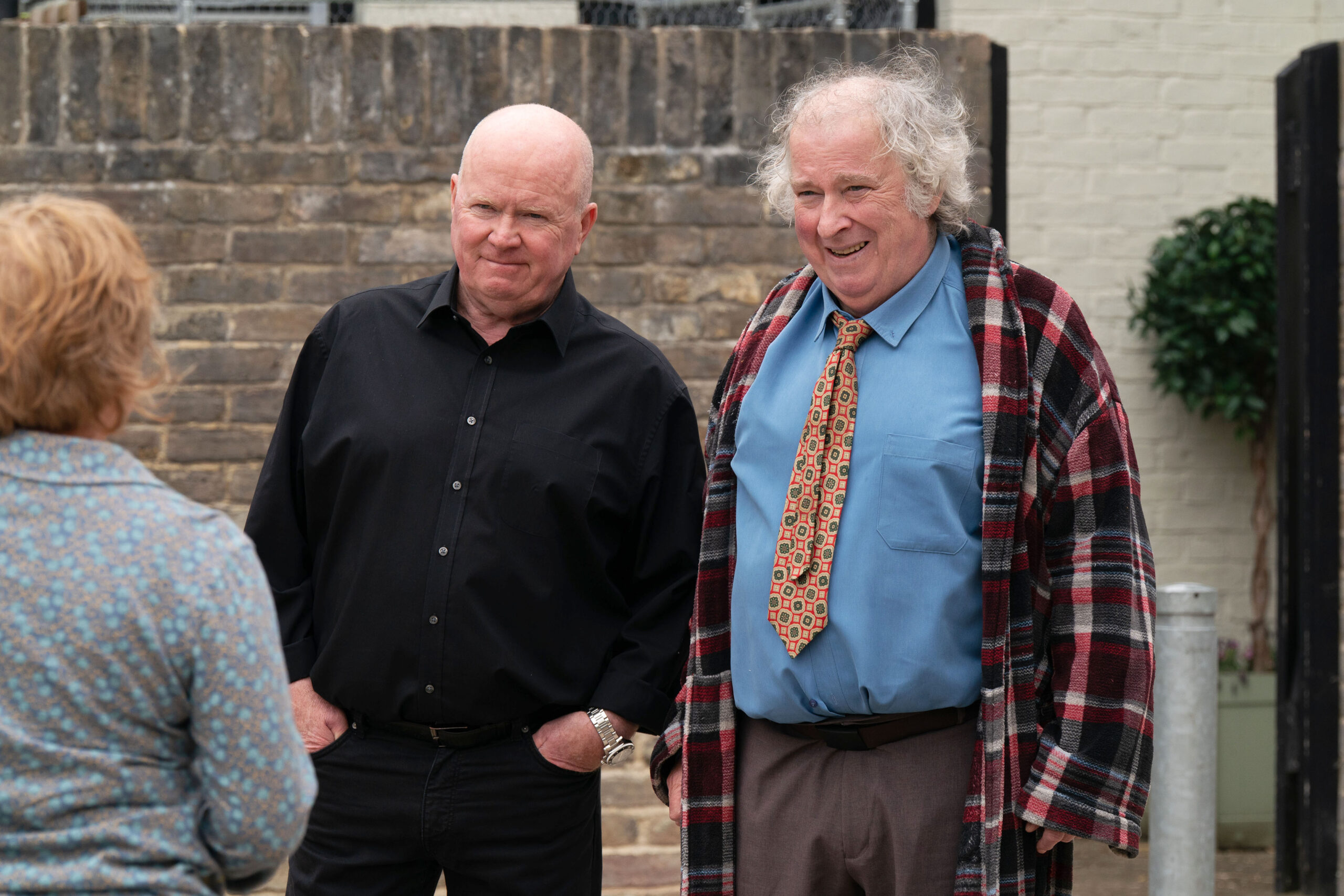 Julie talks to a smiling Nigel and Phil