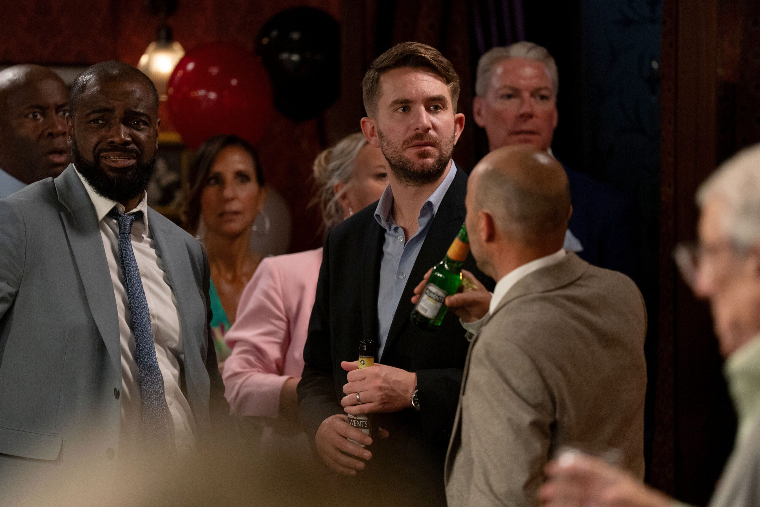 Callum and the guests of Patrick and Yolande's wedding look shocked