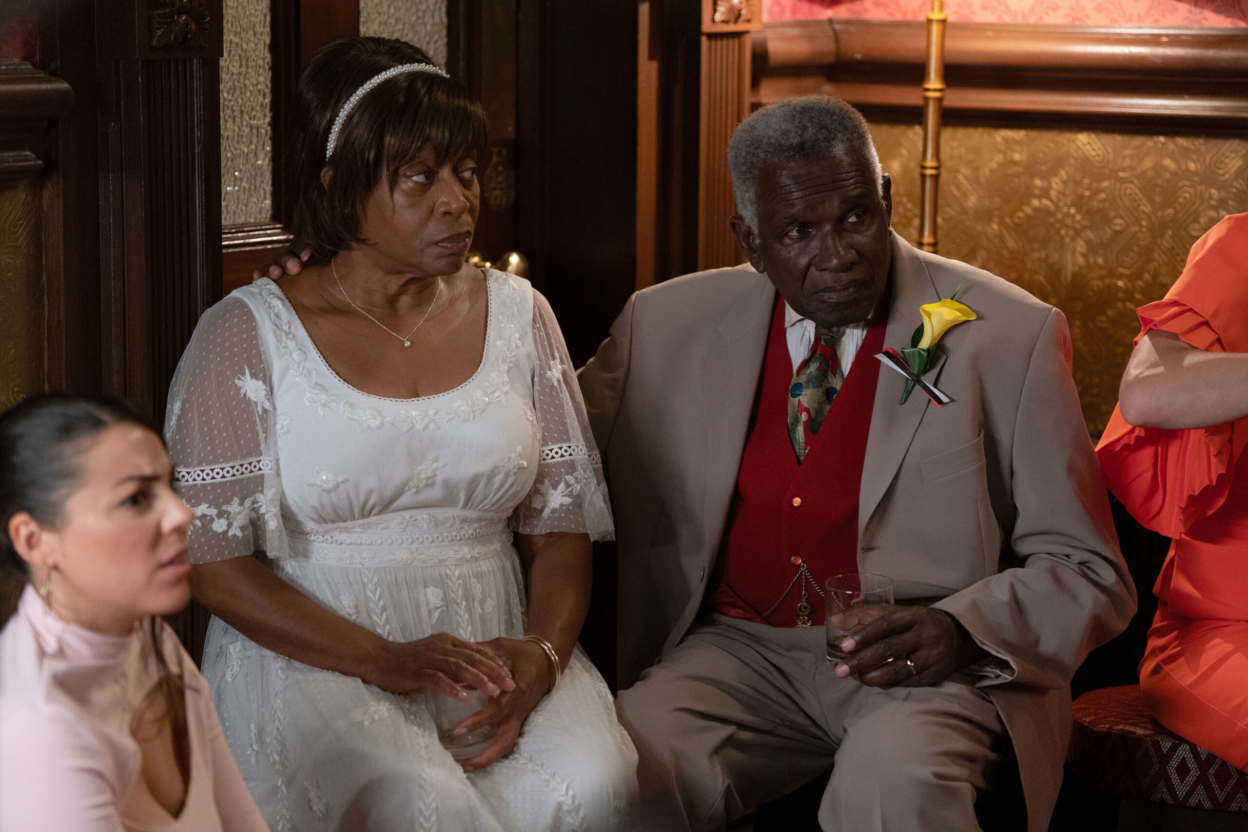 Patrick and Yolande look worried at their wedding ceremony
