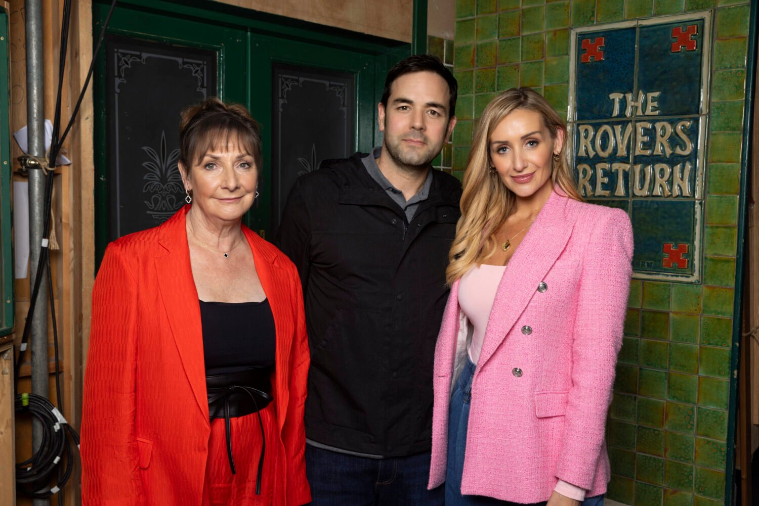 Aaron McCusker, Pauline McLynn and Catherine Tyldsley outside the Rovers on Corrie