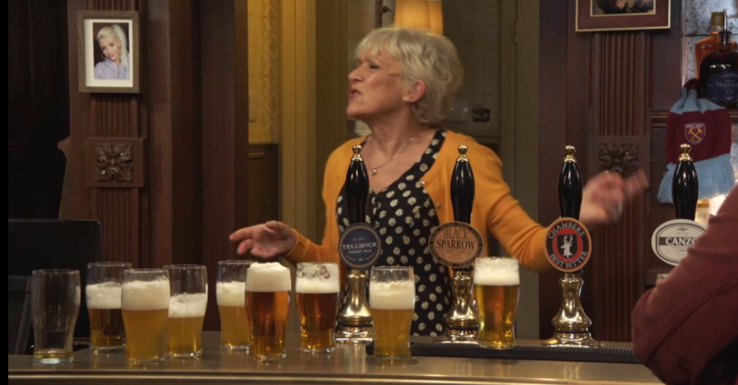 Jean with loads of terribly poured pints in The Vic