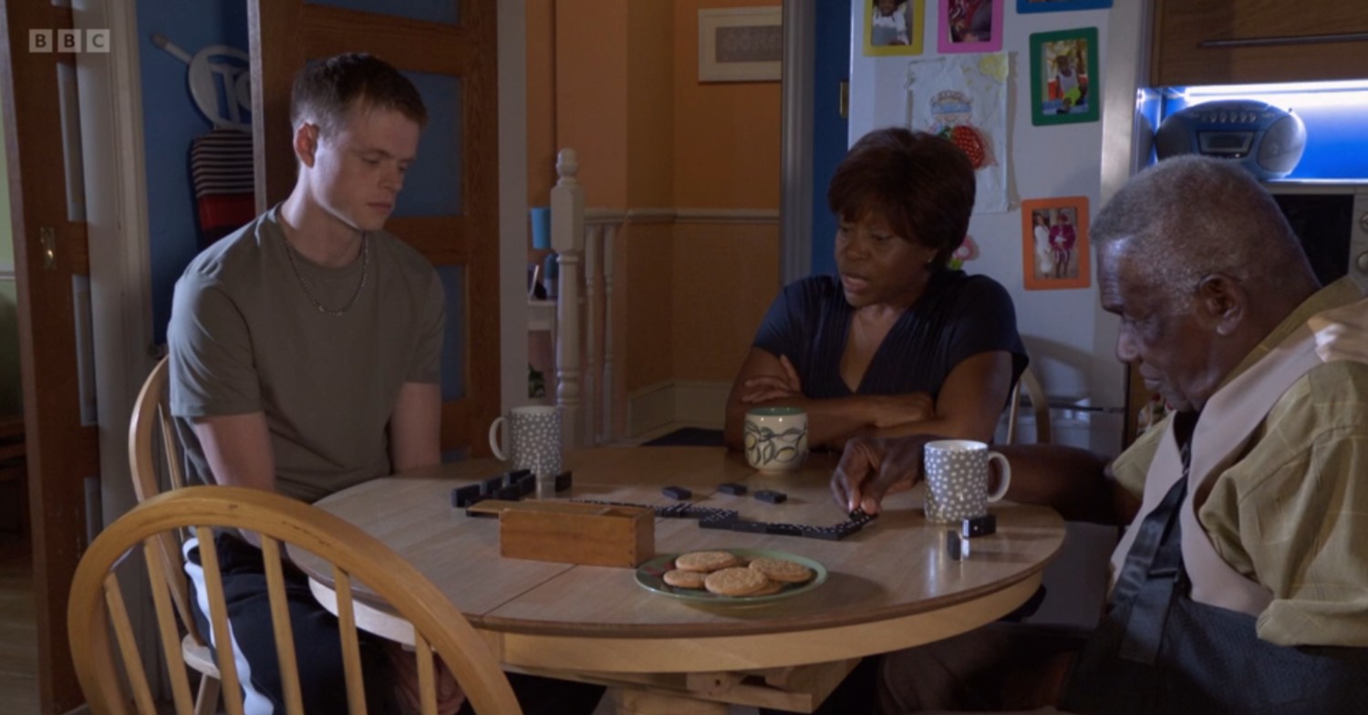 Oscar with Patrick and Yolande, playing dominoes