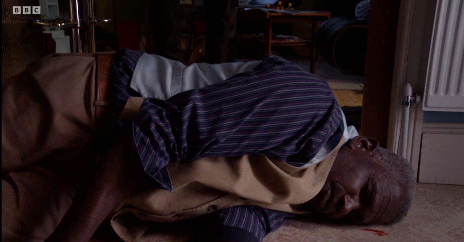 Patrick unconscious on the floor in EastEnders