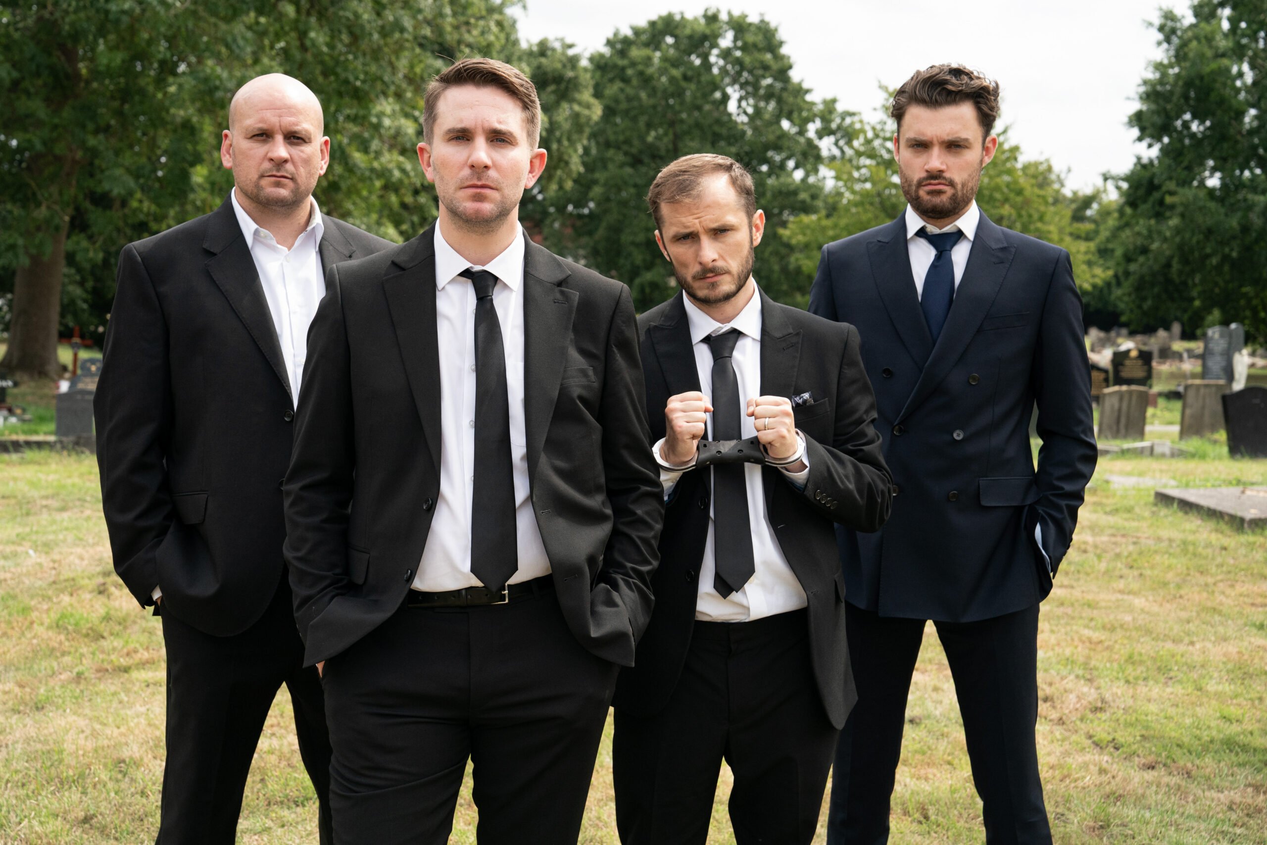 Stuart, Callum, Ben and Johnny in suits at a funeral