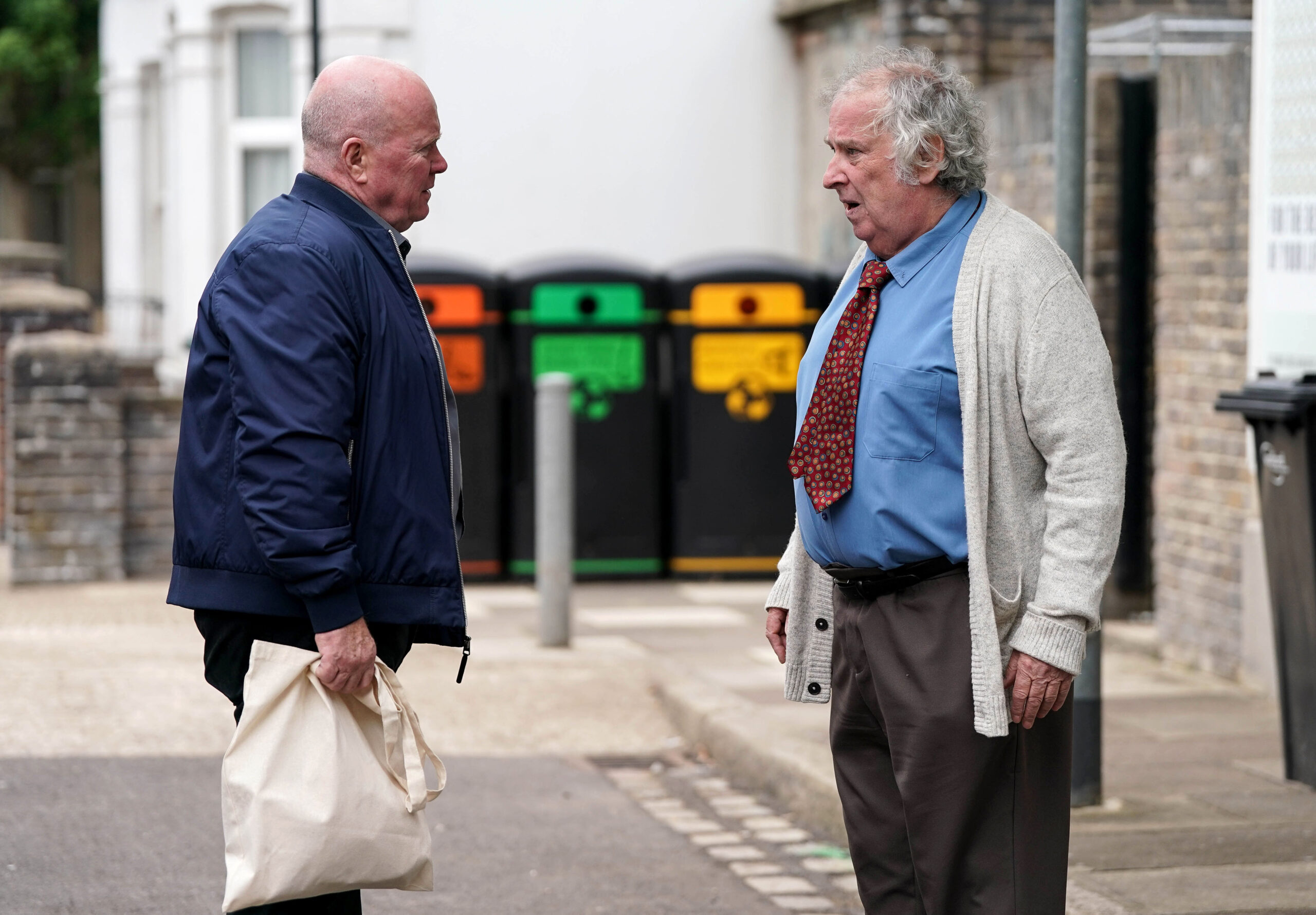 Nigel and Phil talk in the Square