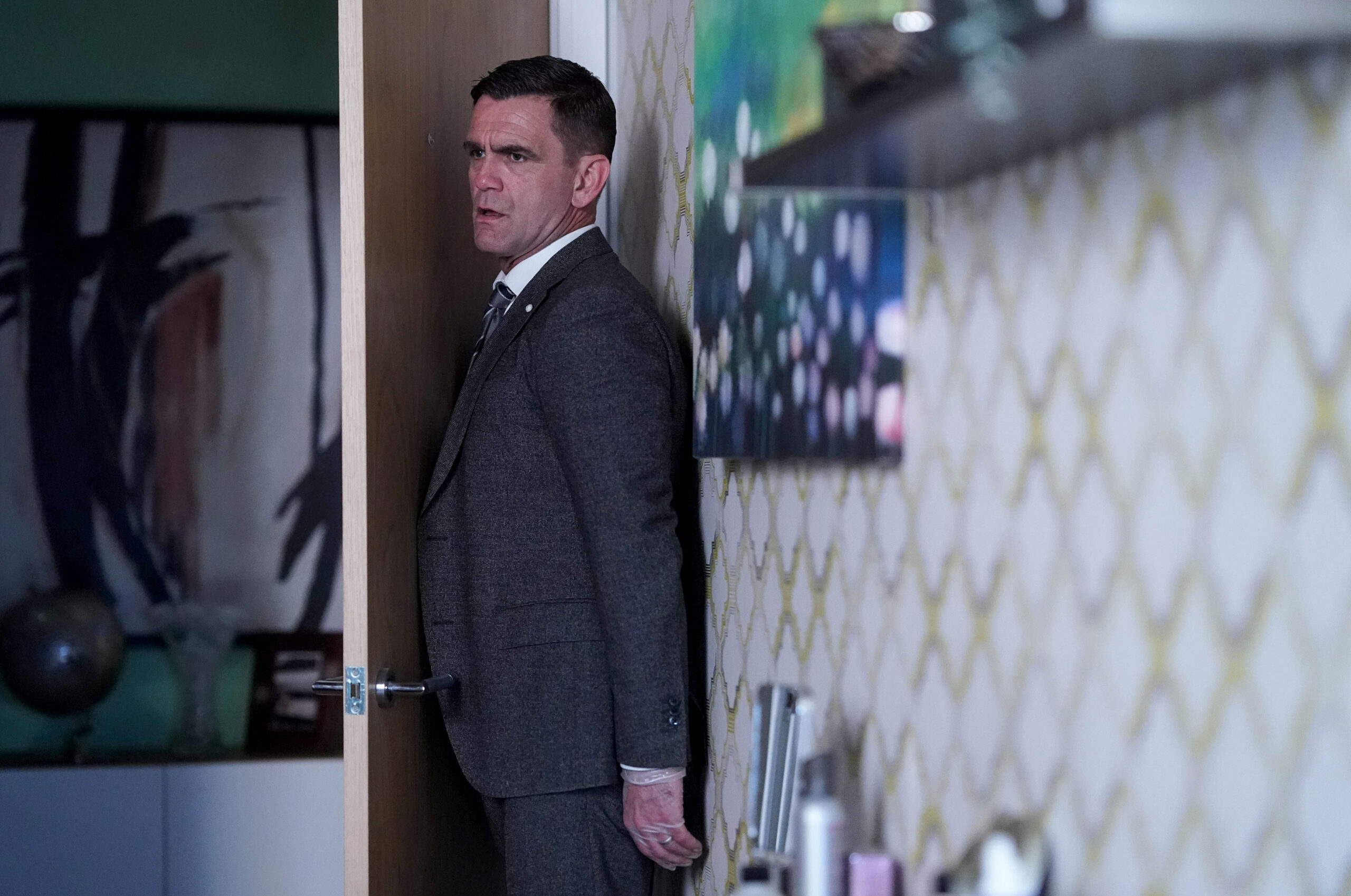 Jack hiding in Ravi's kitchen on EastEnders