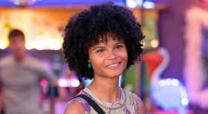 Jasmine smiling on EastEnders - but is she Zoe's daughter? (Credit: BBC/Composite: EI)