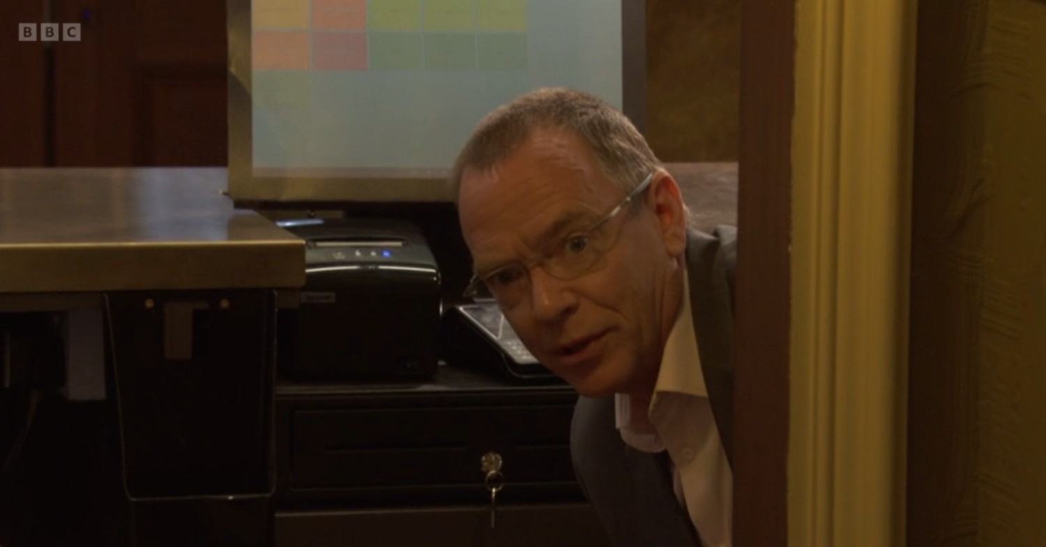 Ian peeks around the door on EastEnders