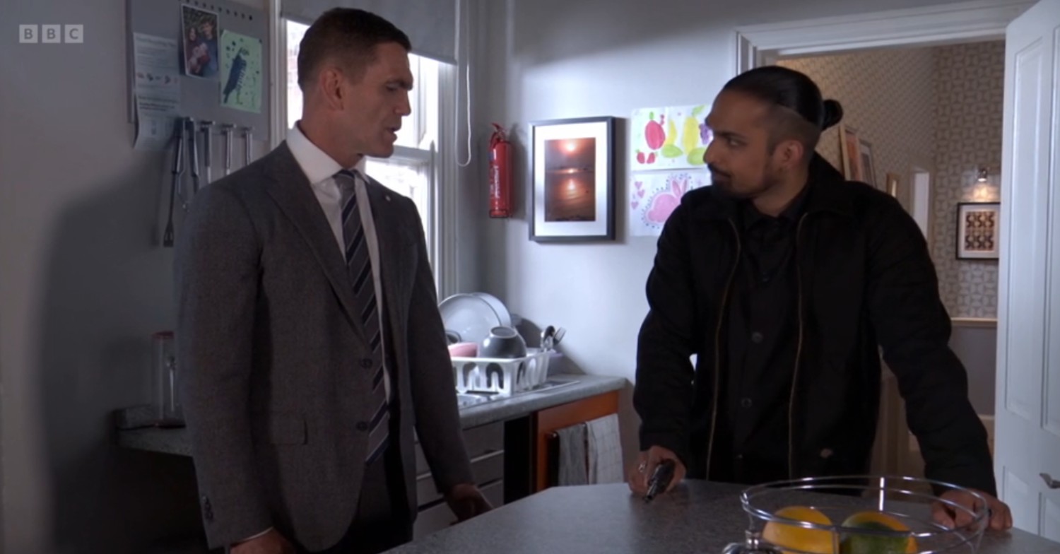 Jack and Ravi share a tense conversation over the kitchen table