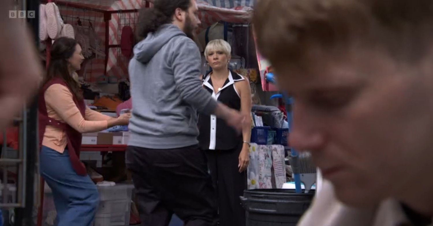 Close-up of Jay's face as he ties Lexi's shoelaces