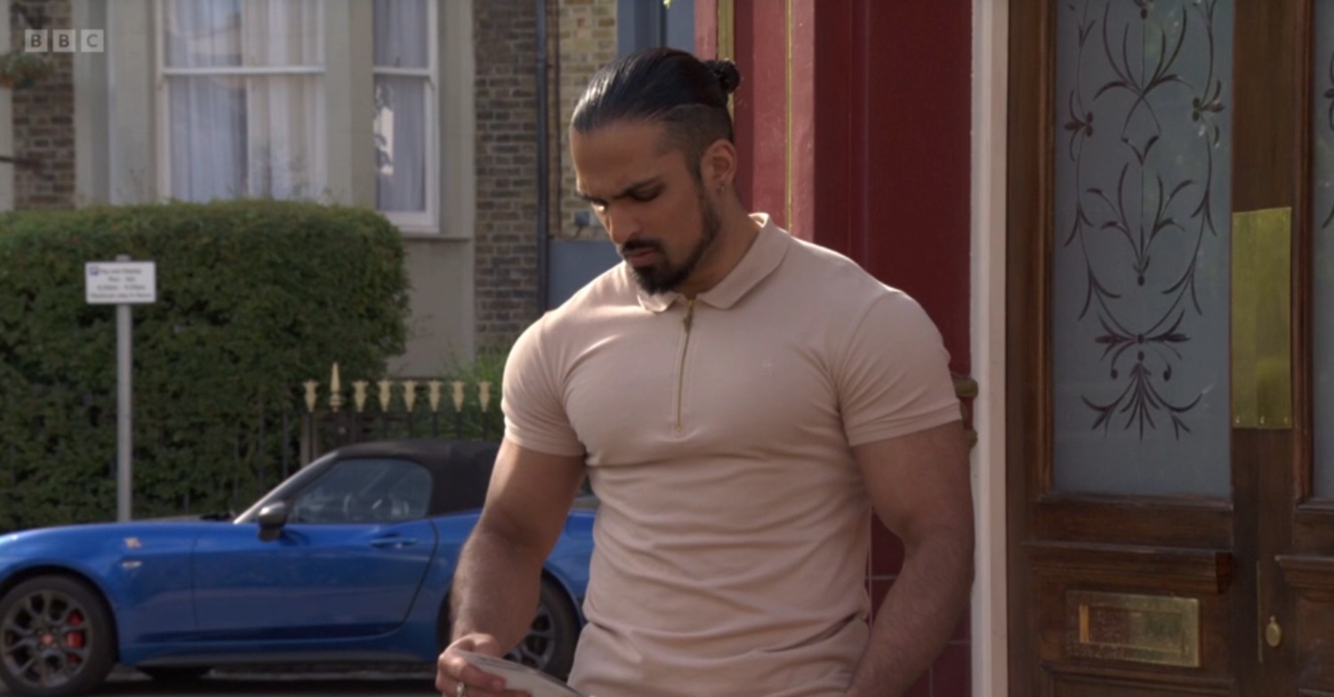 Ravi looks troubled outside The Vic