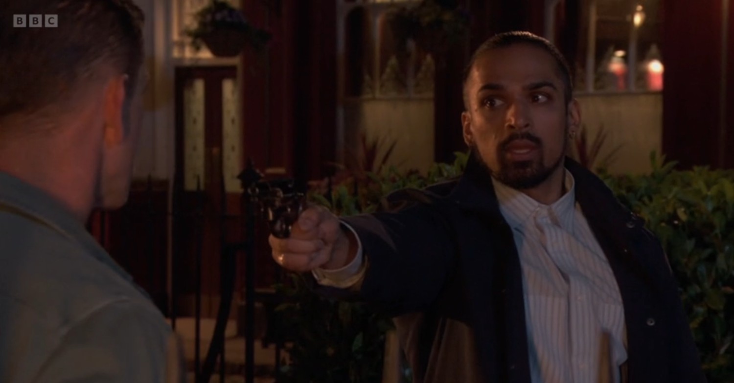 Ravi points a gun at Jack on EastEnders