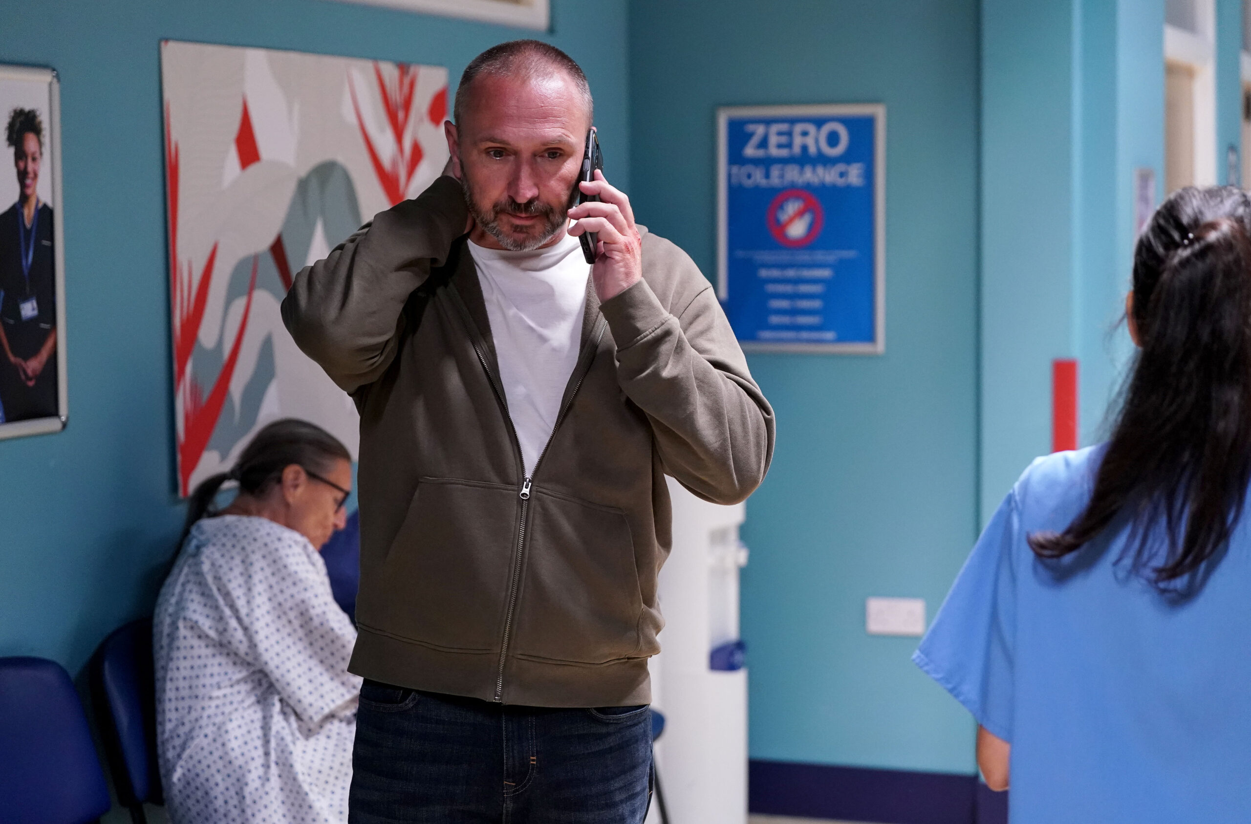 Ross on the phone in the hospital on EastEnders