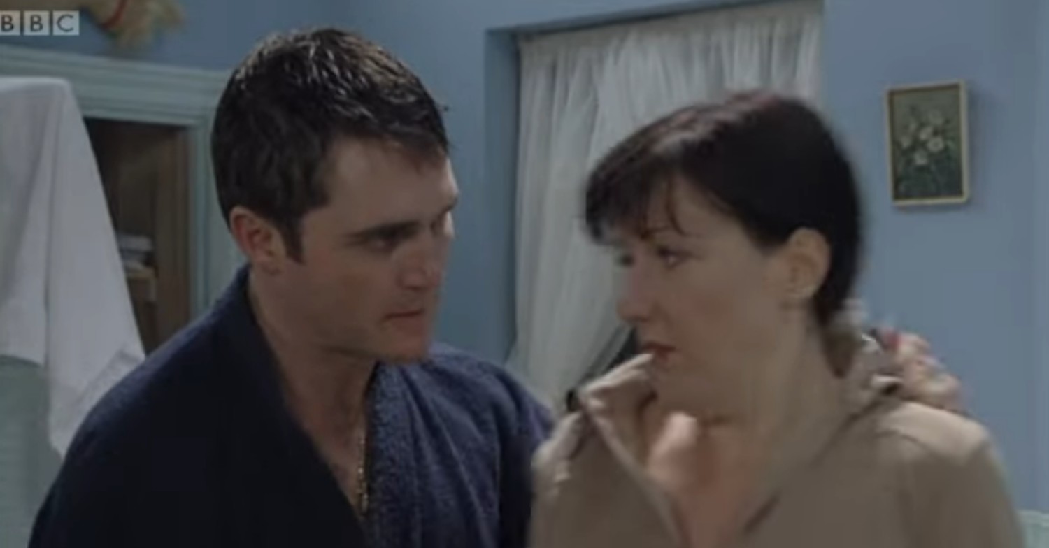 Trevor menaces Little Mo in a scene from EastEnders