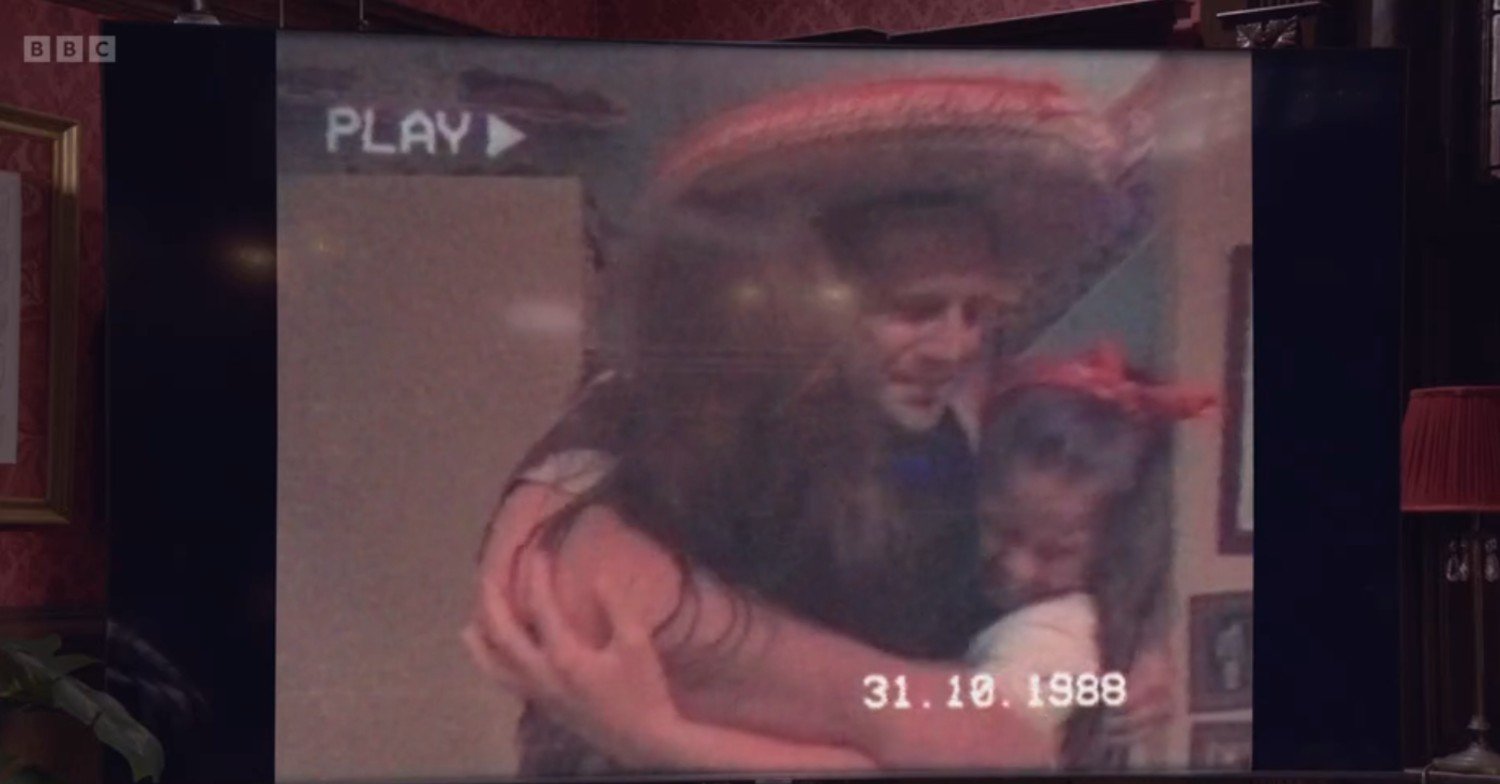 Uncle Harry hugs the kids in EastEnders