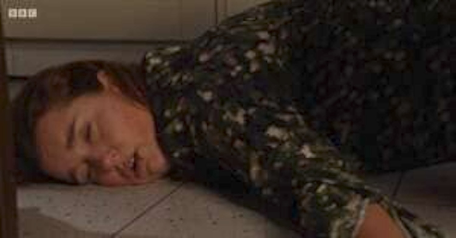 Vicki lies on the floor after being beaten
