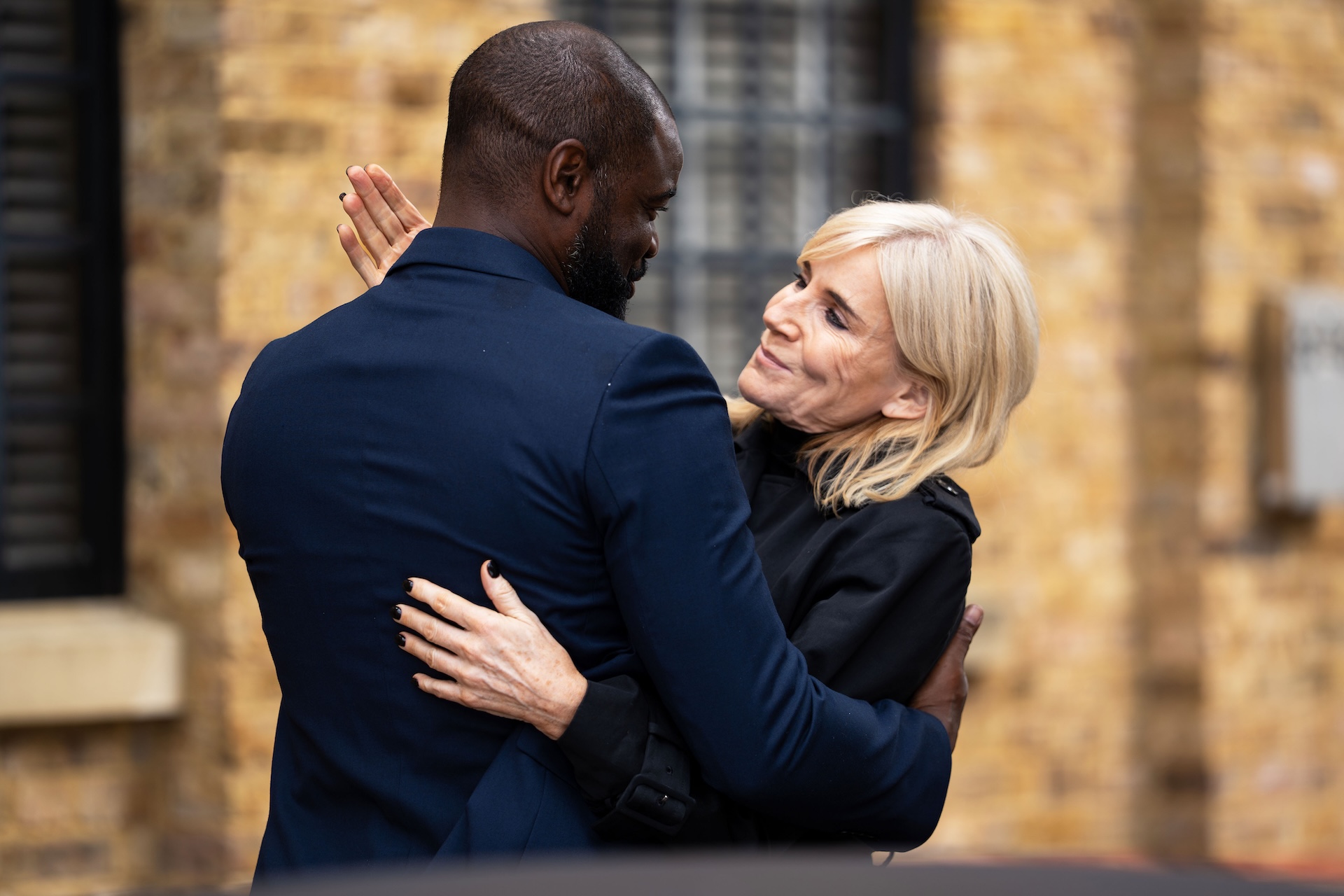 Junior and Cindy share a hug