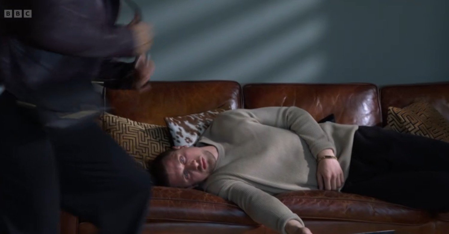 Harry passed out on the sofa in EastEnders