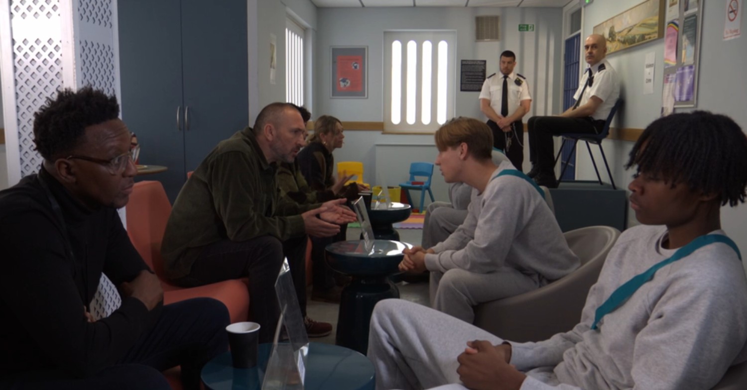 Ross visits Joel in the detention centre