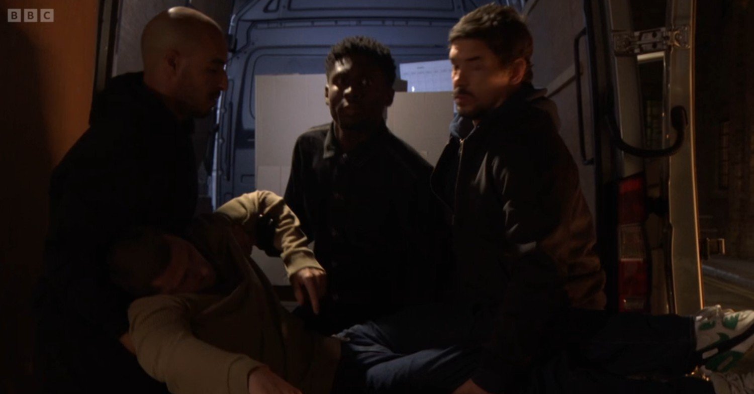 Okie bundles Harry into the back of a van with his thugs