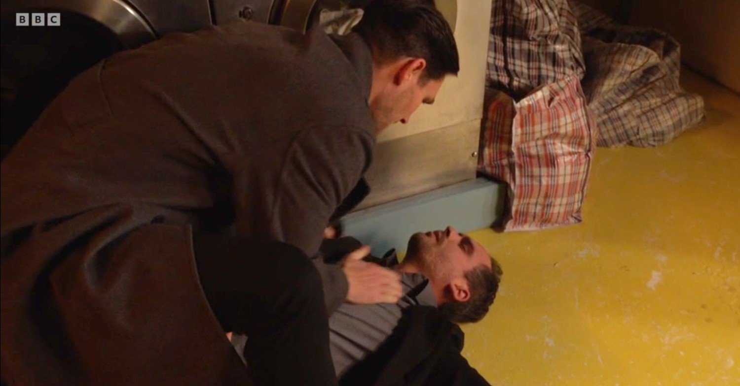 Zack stands over unconscious Damon in EastEnders