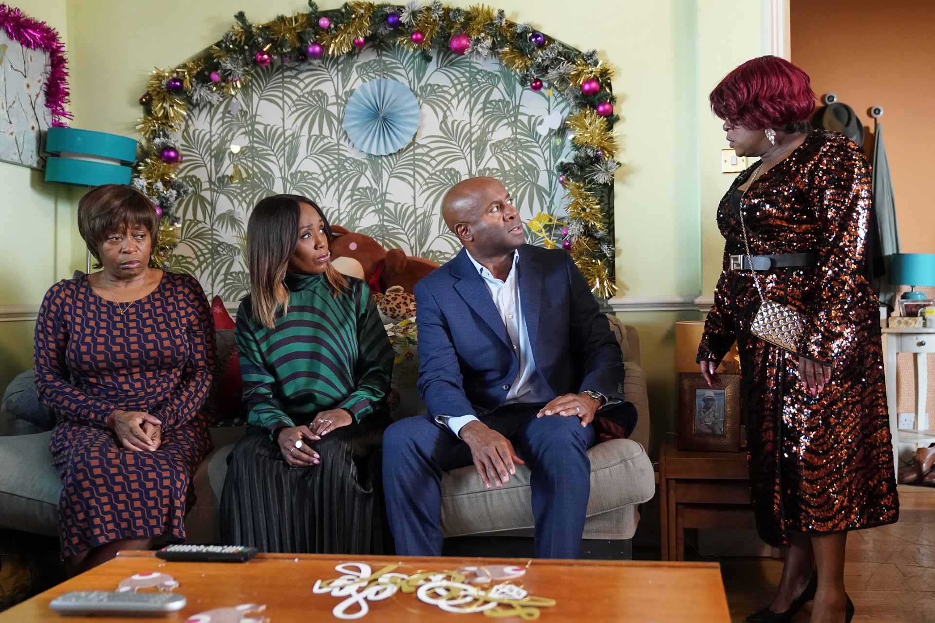 Yolande, Denise and Anthony sit on the sofa while Kim shouts at Anthony
