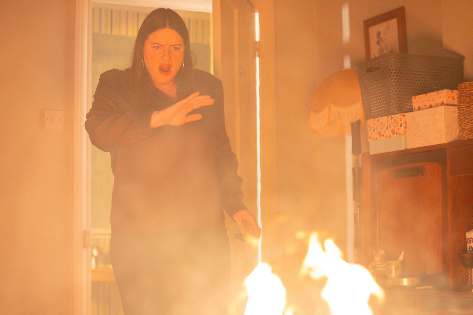 Zoe in a flaming house