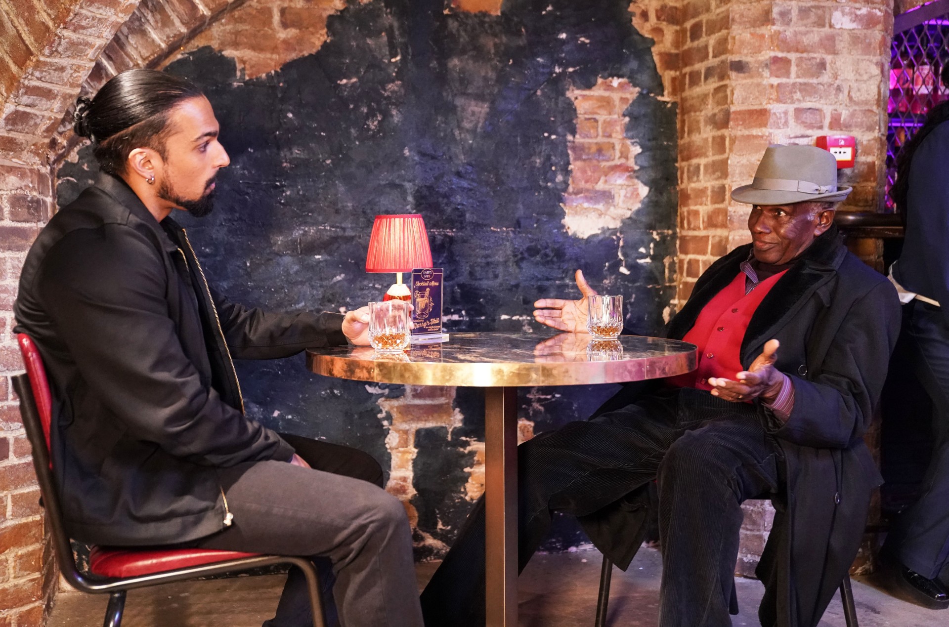 Patrick and Ravi talk in Harry's Barn