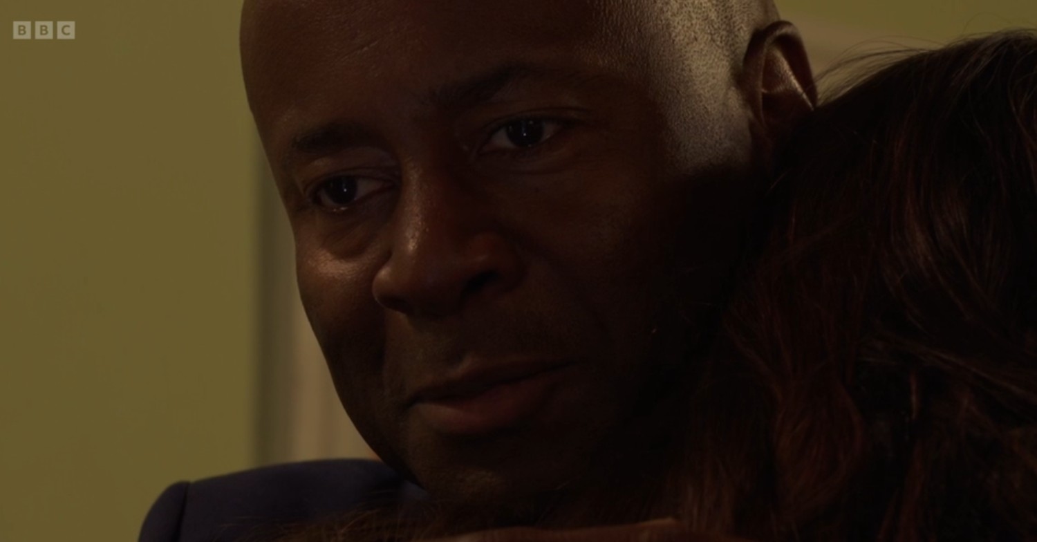 Anthony hugs Zoe while smiling in a creepy manner