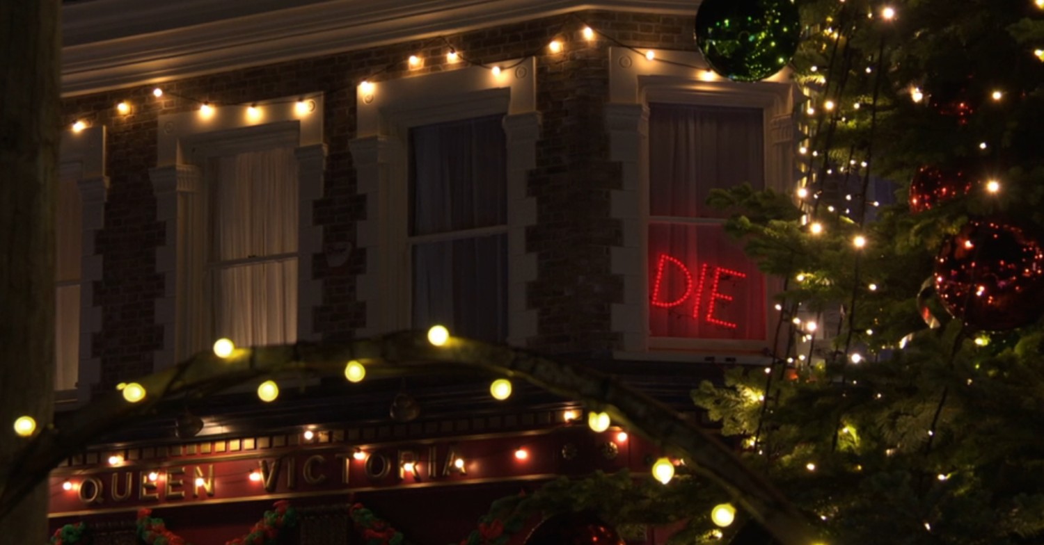 The word 'die' written in lights in the window of The Vic