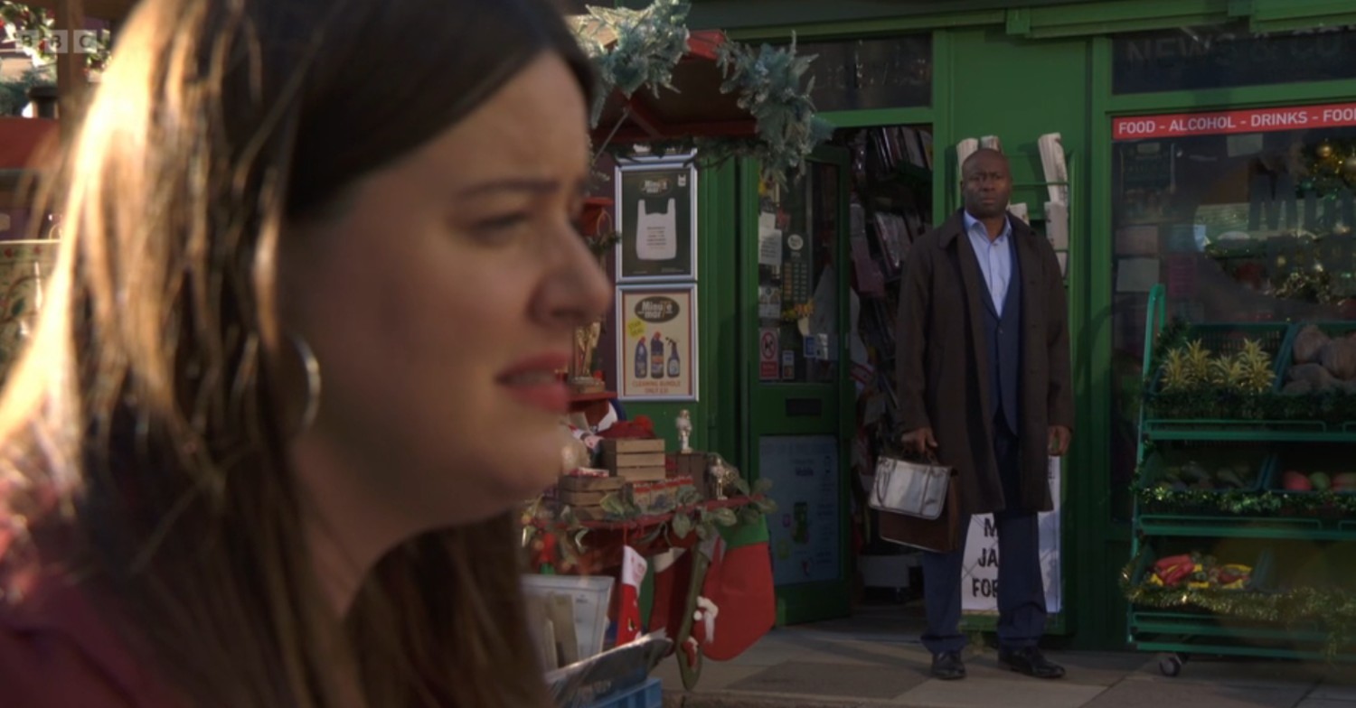 Zoe talks to Kat while Anthony lurks in the background