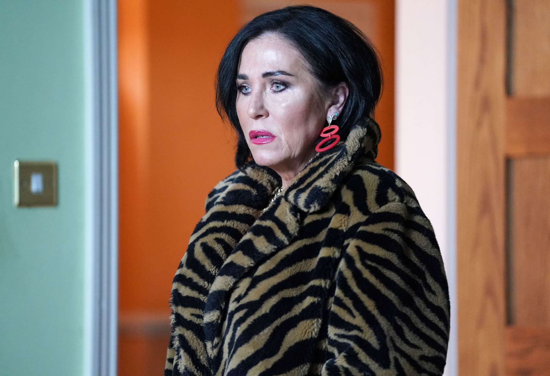 Kat in her furry coat and looking worried in EastEnders spoilers 
