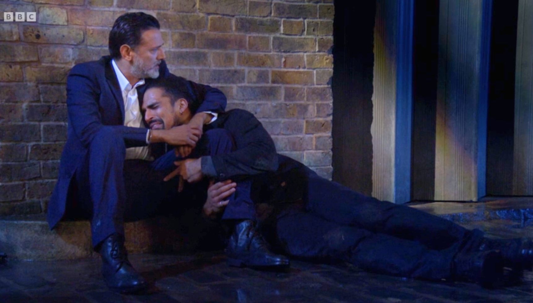 Nish cradles Ravi in EastEnders