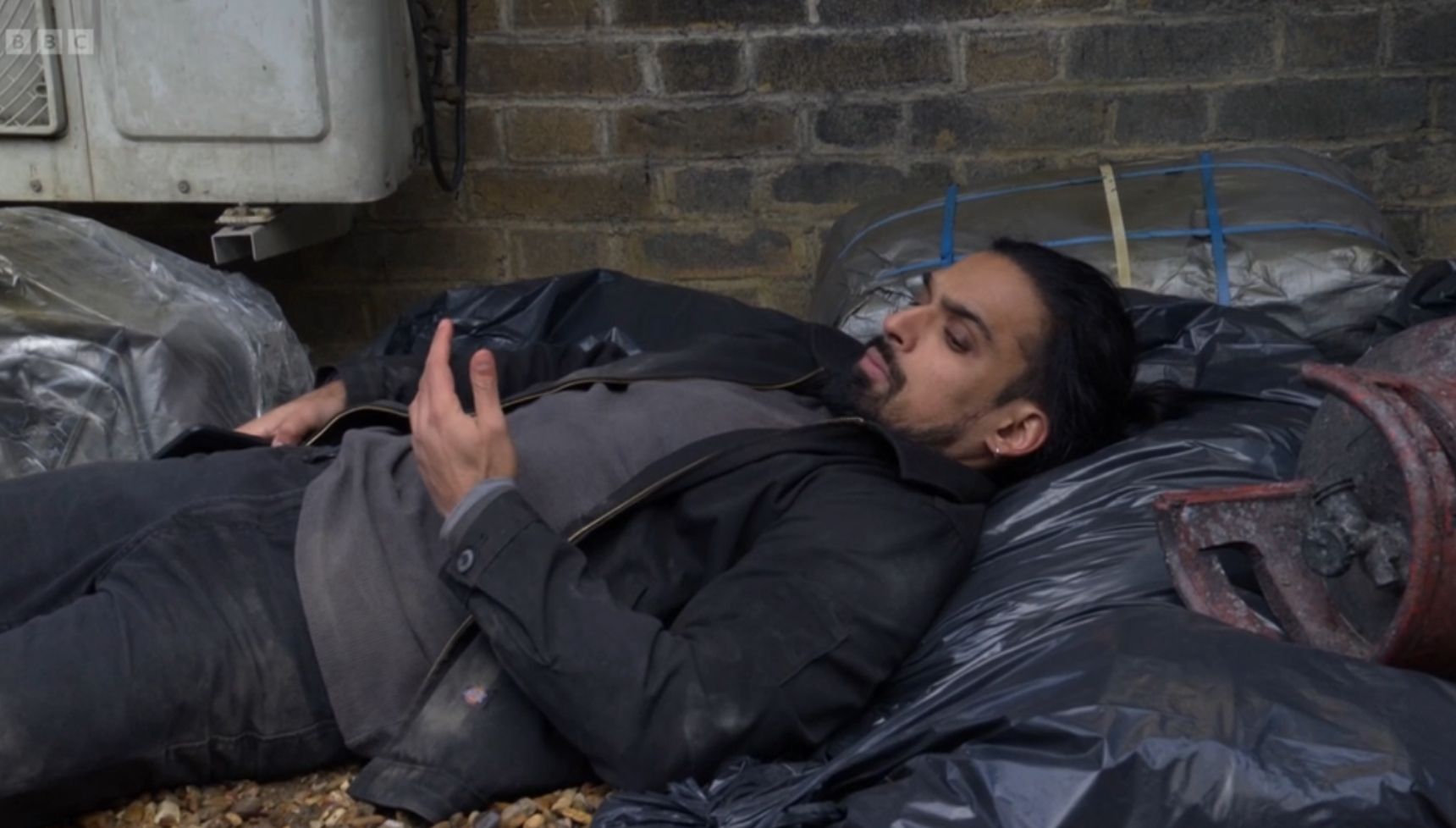Ravi in the rubbish on EastEnders