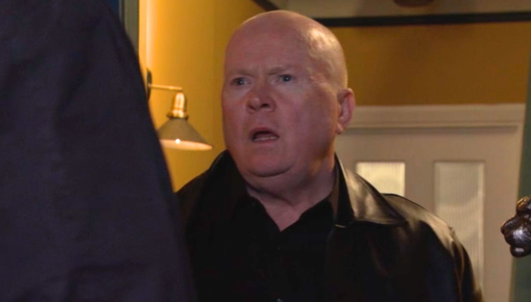 Phil answering the door with shocked look on his face