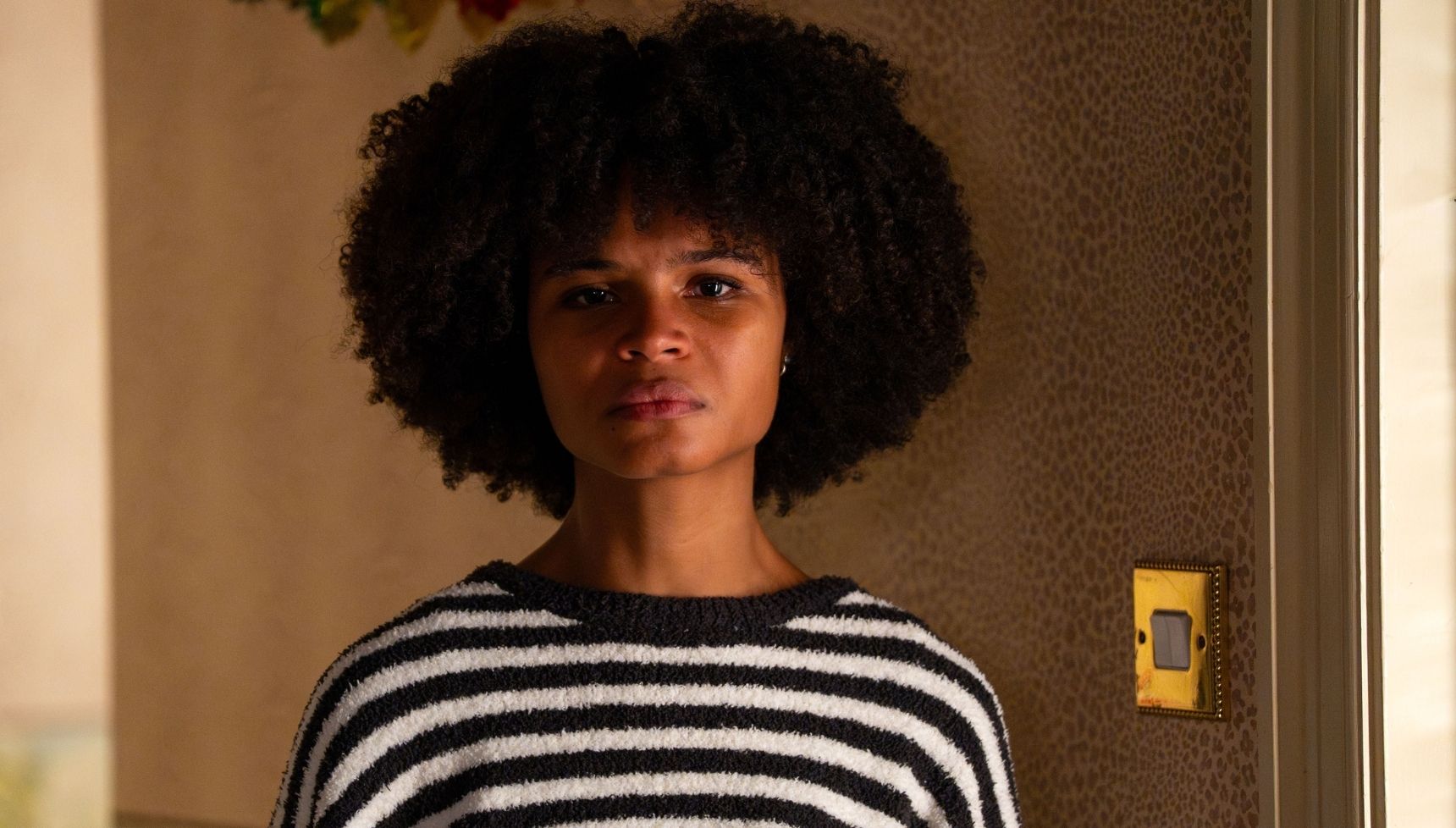 Jasmine looking worried in the Slater house